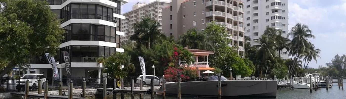Seacliff's office building on the waterfront, with yachts moored along the seawall in front